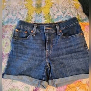 Classic Levis Mid Length Women's Denim Shorts - Dark Blue. Size 25